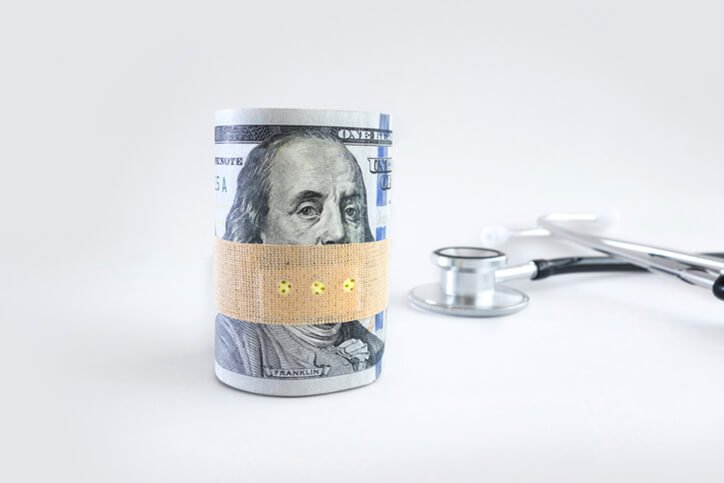 money wrapped near stethoscope - top rated joint replacement surgeons in Portsmouth, New Hampshire